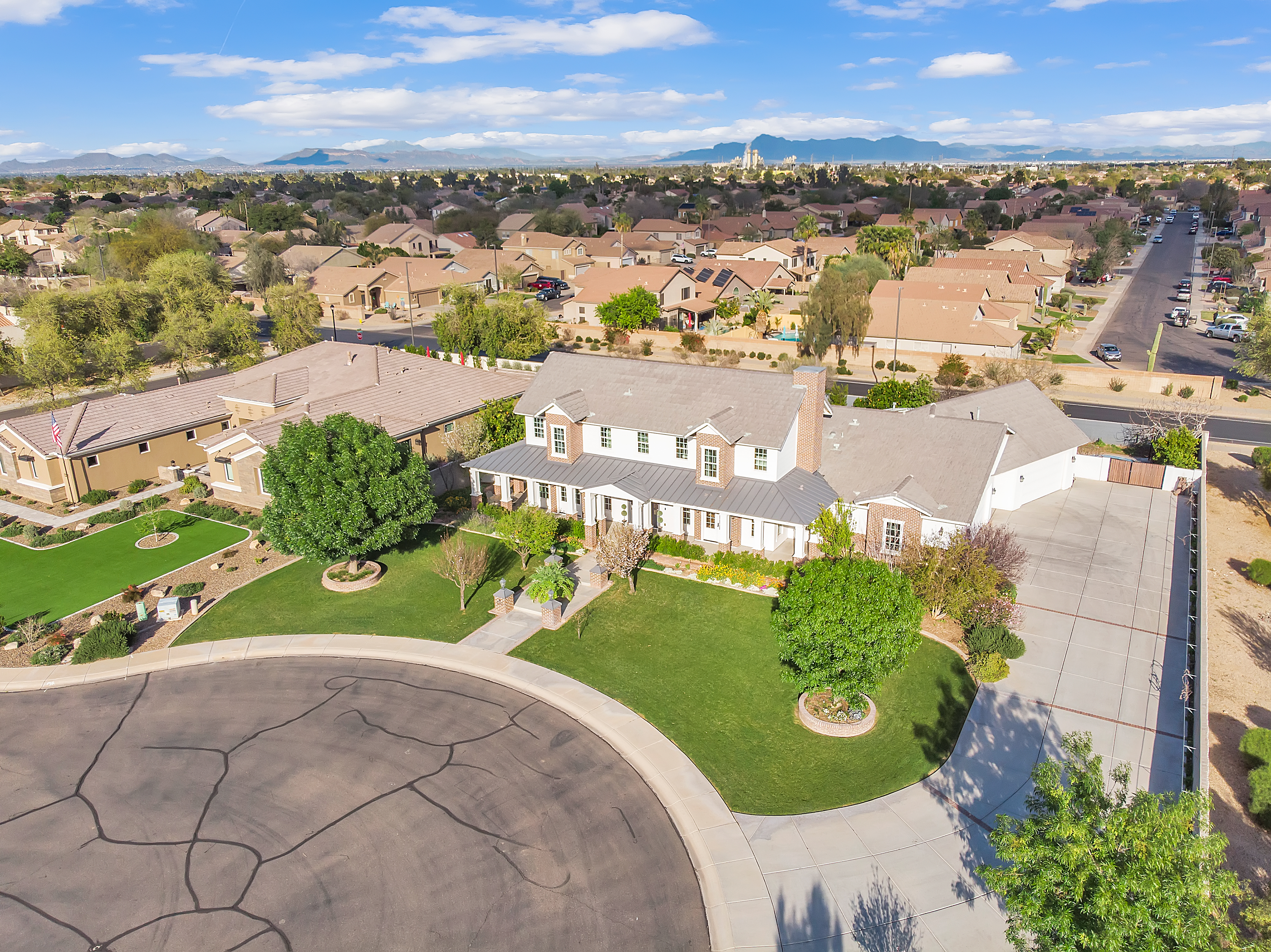 Aerial drone photography of large estate with circular driveway